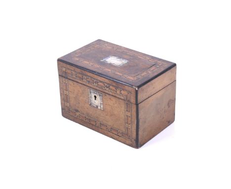 A Victorian mahogany tea caddy. With marquetry decorative bandings to the lid and frontal panel and a mother of pearl escutch