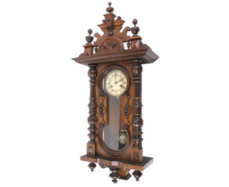 A Junghans Vienna style wall clock. The enamel dial with Roman numerals and stamped 'Junghans', the glazed frontal panel flan