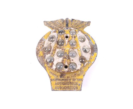 An early AA cast iron post mounted plaque. Painted yellow and marked 'The Property of the Automobile Association', with fourt