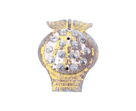 An early AA cast iron post mounted 'Cat's Eyes' plaque. Painted yellow and marked 'The Property of the Automobile Association