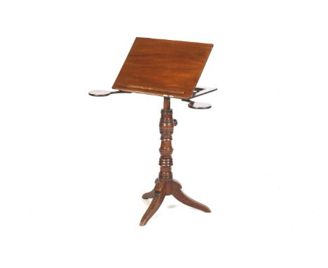 A Victorian mahogany music stand or reading table. With an adjustable rounded rectangular top with candle slides below, on a 