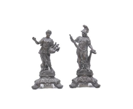 A pair of patinated bronze figures. Both filled, modelled as Roman deities, one holding a harp, the other wearing a suit of a