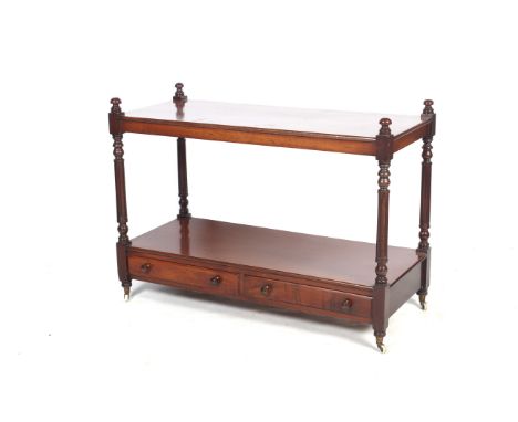 An early 20th century mahogany buffet. With plain top over turned and fluted supports with lower two drawer shelf, on casters
