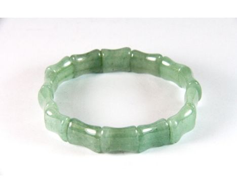 A finely carved bamboo style jadeite jade bracelet