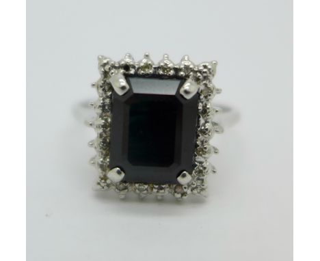 A 9ct white gold, diamond and blue stone ring, 4.2g, R