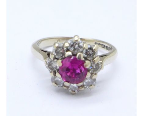 An 18ct gold, ruby and diamond cluster ring, 4.7g, M