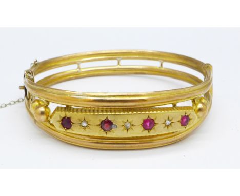 A Victorian diamond and ruby set bangle