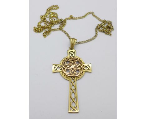 A Celtic style 9ct gold cross with plated chain, cross 4.4g