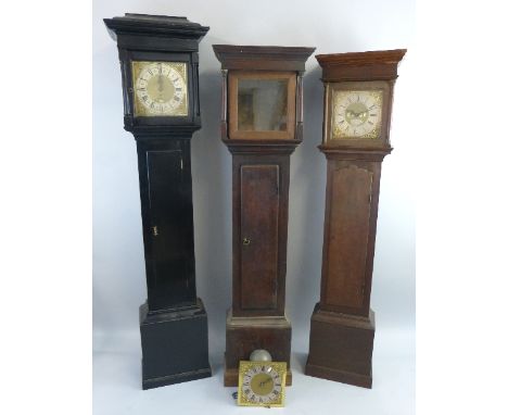 A longcase clock, the 30 hour striking movement to a brass dial with date aperture, ebonised case, height 206cm, a longcase c
