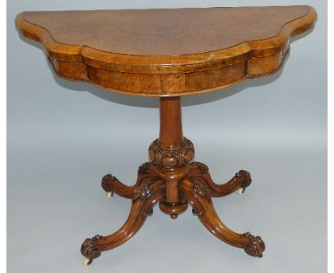 A Victorian walnut and burr walnut fold-over card table, the moulded edge top of double serpentine semi-circular form with sw