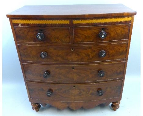 A Victorian mahogany bow-front chest, of two short and three long graduated cock beaded drawers with turned knob handles, the