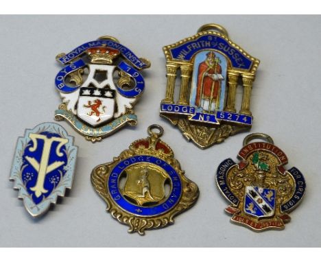 Four silver gilt and enamel Masonic medals and a a silver and enamel clip, weight 79 grams