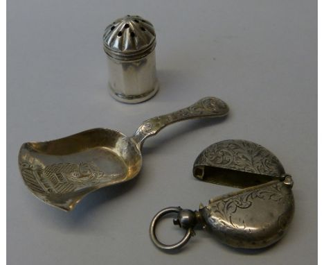 A Victorian silver caddy spoon, Birmingham 1853, the shaped bowl with engraved decoration, a silver circular coin holder, Bir