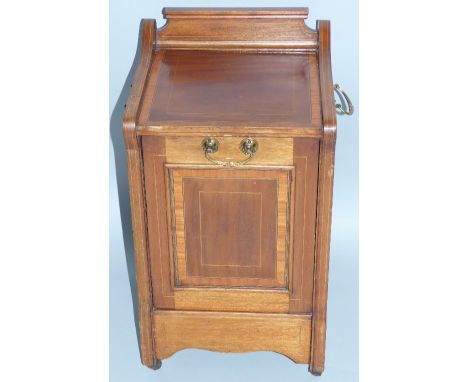 An Edwardian mahogany coal purdonium, with satinwood crossbanding and boxwood stringing, the oblong top with raised back, sha