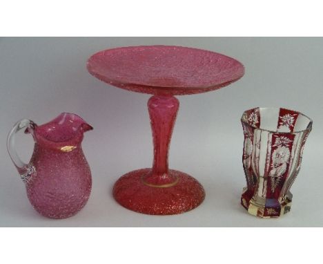 A cranberry crackle glass comport, with dished circular top, hollow baluster stem and domed foot, 18.5cm diameter, a similar 