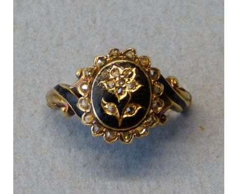 A Victorian 18ct gold, enamel and diamond mourning ring, London 1855, the oval black enamel panel inset with a rose diamond s