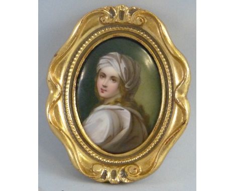 A 19th century continental porcelain plaque,  of oval form depicting a head and shoulder portrait of a young girl, indistinct