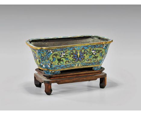 Antique Chinese Cloisonné Enamel PlanterAntique Chinese cloisonné enamel planter; the small footed rectangular form with notc
