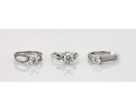 Three 14K Gold, Diamond & Cubic Zirconia RingsGroup of three 14K white gold engagement rings: each centering a round cut cubi
