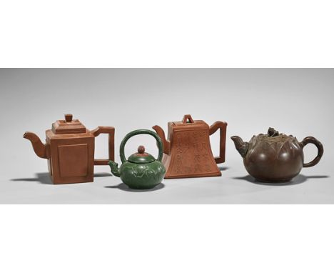 Four Chinese Yixing Pottery TeapotsFour Chinese Yixing pottery teapots: two on square bases with simple designs; lotus bulb w