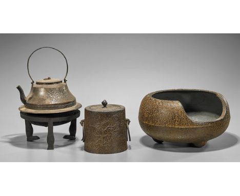Three Chinese Iron VesselsGroup of Chinese iron objects, including: large tripod vessel, covered jar with dragon, and tea ket