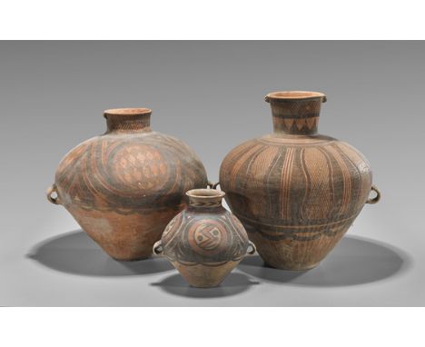 Three Chinese Neolithic Pottery VasesThree Chinese Neolithic Period painted pottery vases: each of tapered bulbous form with 