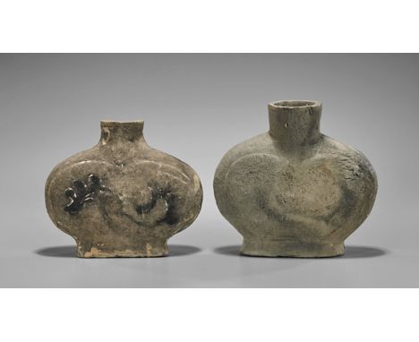 Two Han Dynasty Pottery JarsTwo Chinese Han Dynasty pottery jars; of flattened ovoid form with raised base, one with foliate 