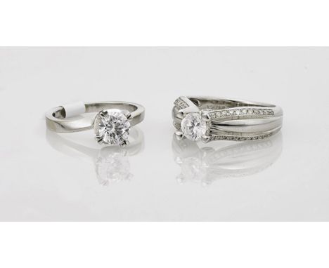 Two 14K White Gold Solitaire Engagement RingsTwo 14K white gold solitaire engagement rings; each centering a round-cut cubic 
