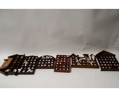 COLLECTION OF VARIOUS CERAMIC THIMBLES IN WOODEN DISPLAY CASES