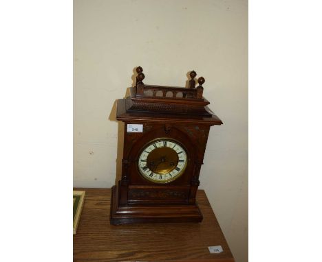 LATE 19TH CENTURY MANTEL CLOCK IN DARK WOOD ARCHITECTURAL CASE WITH APPLIED FLORAL DECORATION