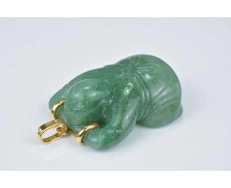 A vintage green jade pendant in the form of a Chinese boy lying on his front with 14ct gold clasp stamped 'KY' 585. With J.Ku