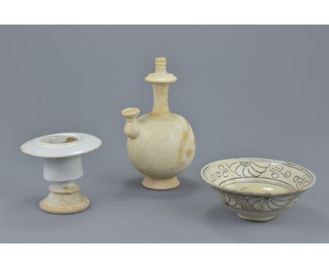A group of three Chinese Song dynasty white glazed pottery items. To include a water bottle, an oil lamp and Cizhou ware pott