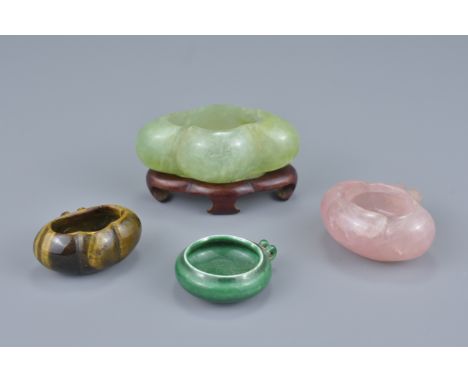 A group of three Chinese 19/20th Century bird feeders and pot in various forms. To include a pink quartz bird feeder, a tiger