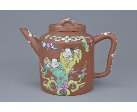 A Chinese Yixing teapot with enamel decoration of figures and blossoms. 15Cm x 18cm