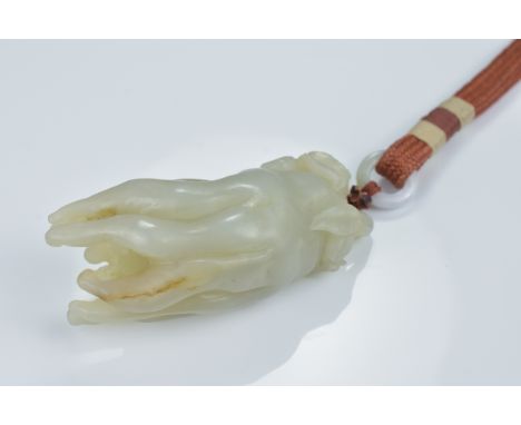 A Chinese pale greenish white jade carving of a 'Buddha's hand' citron. 7.5cm length