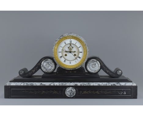 A very large Victorian black slate mantle clock with visible escapement and two train movement. With pendulum. No key. 75cm l