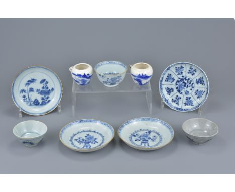 A group of 19th Century Chinese porcelain items. To include four blue and white porcelain saucers one with brown glazed exter