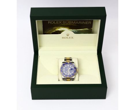 Herrenarmbanduhr "ROLEX". Modell "Oyster Perpetual Date Submariner". Gehäuse und Fliplock-Band aus Edelstahl und 750/000 GG. 