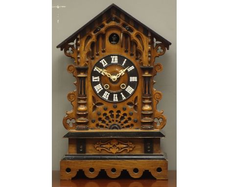 Late 19th/early 20th century Black Forest style cuckoo clock, arched architectural case, striking the hours and half on coil 