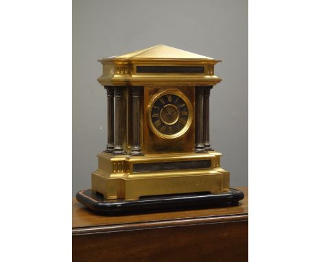 20th century brass architectural mantel clock, fluted Corinthian columns, twin train movement with Arabic dial, on ebonised p