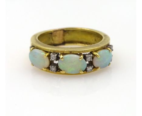 Opal and diamond gold ring, three opals and eight diamonds, stamped 18k 750 approx 7.1gm   Condition Report  size o-p Click h