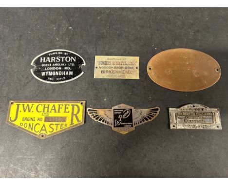 Six garage supplier plates, plaques, badges, emblems.
