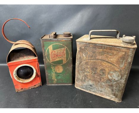 An Esso two gallon can with plain cap, a road lamp and a Wakefield Castrol Motor Oil gallon can. 