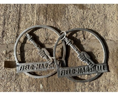 A pair of Field Marshall Tractor cast aluminium emblems. 