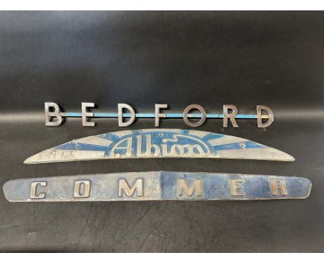 Three lorry/truck radiator name plates: Bedford, Commer, Albion.