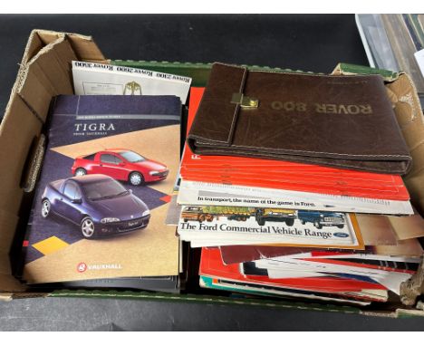 Two boxes of motoring volumes and handbooks including early Vauxhall Nova, Ford Trucks and other Ford etc. 