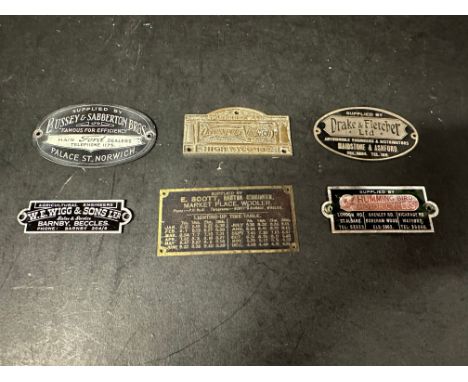 Six garage supplier plates, badges, plaques, emblems.