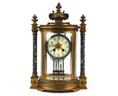 Brass and champleve enamel clock, late19th Century, the case of architectural design with flaming urn finial and two side col