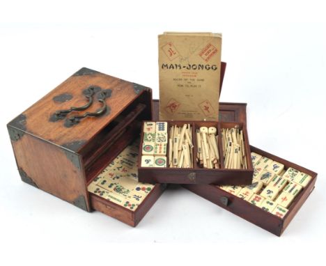 Chinese hardwood Mahjong set, the counters in bone and bamboo, with a Chad Valley instruction book