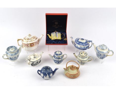 Eight English teapots including one by Royal Crown Derby, and one in the Italian Pattern blue and white by Copeland/Spode; to